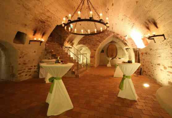 Bar tables for a reception in the small wine cellar